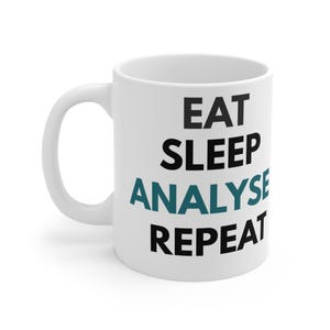 May include: A white ceramic mug with a C-shaped handle featuring the black text EAT and SLEEP on the top two lines, the teal text ANALYSE on the third line, and the black text REPEAT on the bottom line, all in a bold, sans-serif font.