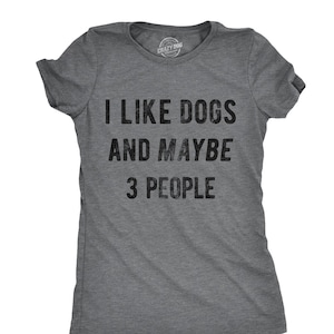 May include: Gray t-shirt with the text "I LIKE DOGS AND MAYBE 3 PEOPLE" in black. The shirt has short sleeves and a crew neck. The brand logo "Crazy Dog" is visible at the top.