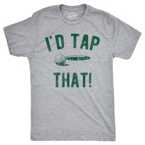 May include: Gray t-shirt with a green graphic that says "I'd Tap That!" and a golf ball going into a hole.