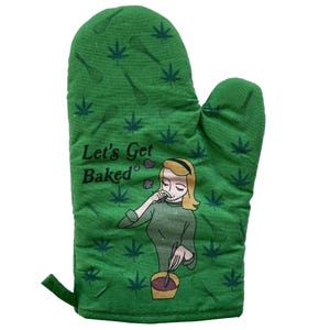 May include: A green oven mitt featuring a repeating pattern of dark green cannabis leaves and whisks. The text Let's Get Baked is printed in black above an illustration of a person with blonde hair holding a spoon over a bowl.
