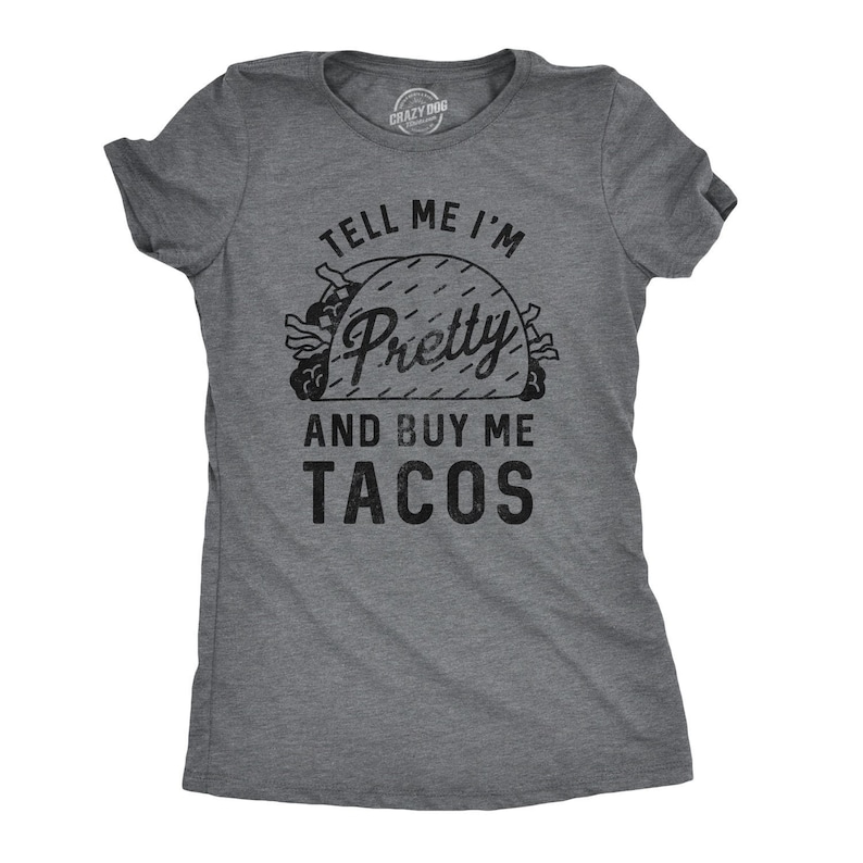 May include: Gray t-shirt with a black graphic of a taco and the text "Tell me I'm Pretty and Buy Me Tacos".