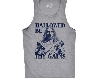 May include: A heather gray sleeveless tank top featuring a dark blue graphic print of a figure with long hair and a beard holding two dumbbells. The text HALLOWED BE THY GAINS is printed in dark blue capital letters above and below the figure.