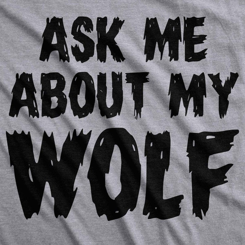 May include: Gray t-shirt with black text that reads "Ask me about my wolf".