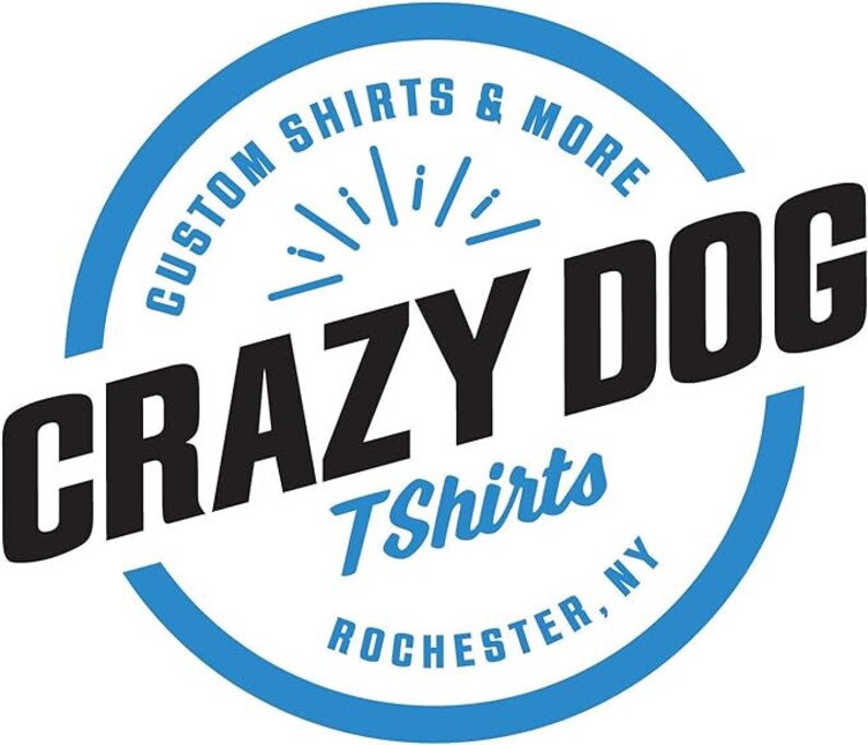 May include: A circular logo with the words "CRAZY DOG" in large, bold, black letters. The words "CUSTOM SHIRTS & MORE" and "TShirts ROCHESTER, NY" are in a blue circular design around the main text.