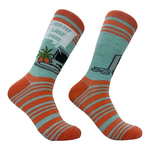 May include: A pair of orange and teal striped socks with a computer and plant design. The socks feature the text "Per my last email".
