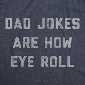 May include: A navy blue t-shirt with white text that reads "Dad Jokes Are How Eye Roll".