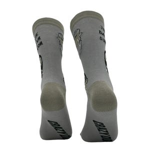 May include: A pair of gray socks with the text "THE BETTER SOR" and "THE DAY SUX" printed on them. The socks also feature cartoon graphics and the words "CRAZY DOG" printed on the bottom.