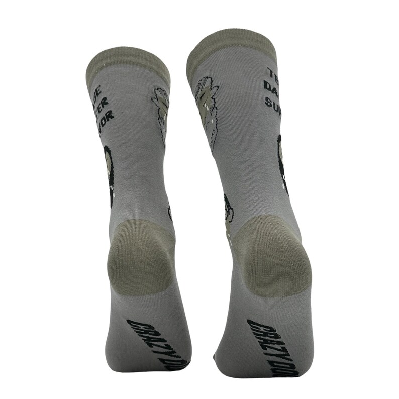 May include: A pair of gray socks with the text "THE BETTER SOR" and "THE DAY SUX" printed on them. The socks also feature cartoon graphics and the words "CRAZY DOG" printed on the bottom.