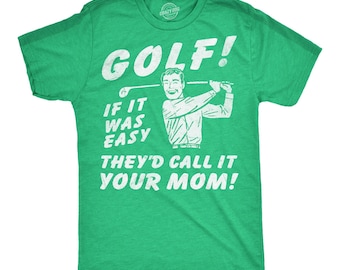May include: A bright green short-sleeved t-shirt featuring a white graphic of a person swinging a golf club. The text reads: GOLF! IF IT WAS EASY THEY'D CALL IT YOUR MOM! The design has a distressed, vintage-inspired texture printed on the front.