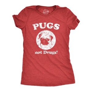 May include: Red t-shirt with a white distressed graphic of a pug with the text "PUGS not Drugs!"