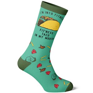 May include: Green and yellow socks with a cartoon taco and the text "I'm into fitness fit'ness taco in my mouth".