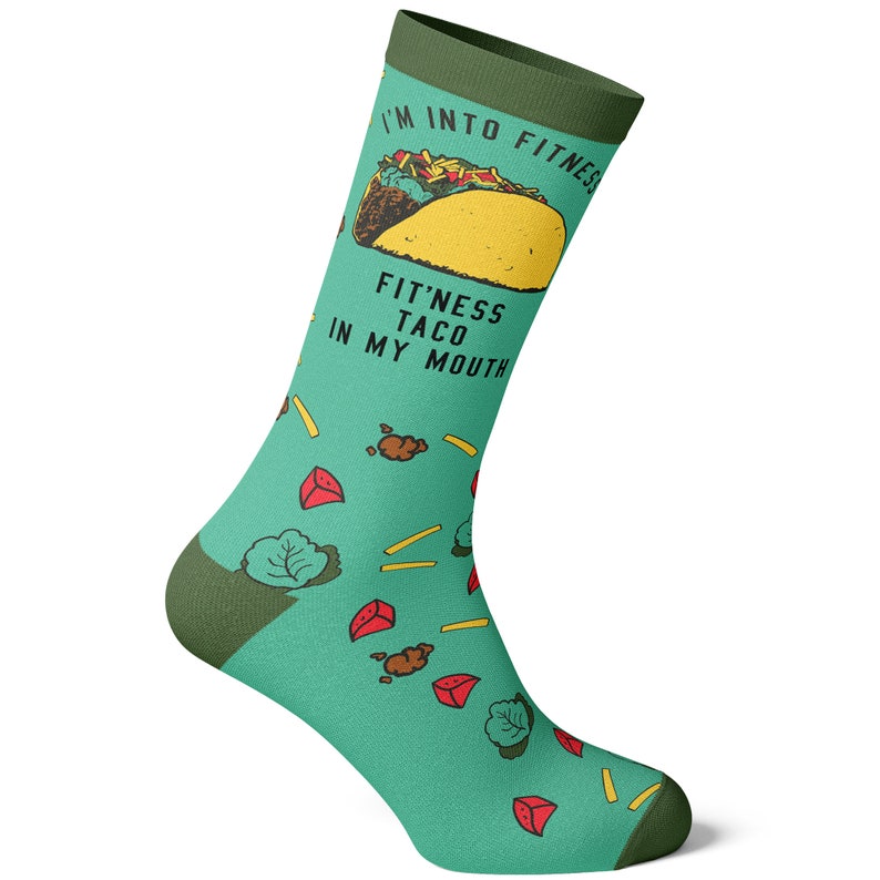May include: Green and yellow socks with a cartoon taco and the text "I'm into fitness fit'ness taco in my mouth".
