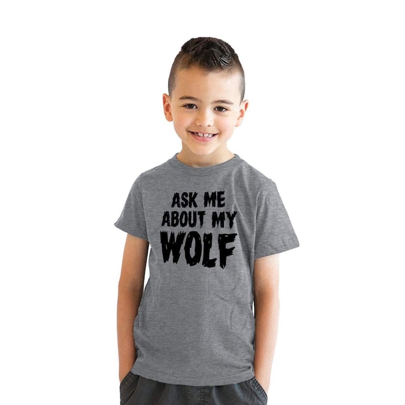 May include: A gray t-shirt with the text "Ask me about my wolf" in black.