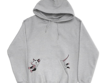 May include: A light gray hooded sweatshirt featuring a graphic illustration of an opossum. The opossum is depicted with its mouth open, appearing to emerge from behind the front kangaroo pocket, with its head and front paws on the left and tail on the right.