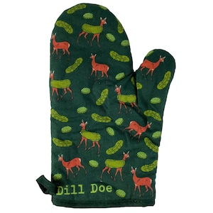 May include: A dark green oven mitt featuring a repeating pattern of brown deer wearing green pickles on their backs, interspersed with small green pickle slices. The text "Dill Doe" is printed in light green near the bottom edge of the mitt.