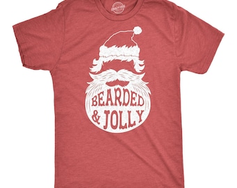 May include: A heather red short-sleeve t-shirt featuring a white graphic of a Santa hat and a large beard. The text BEARDED & JOLLY is printed in white within the beard area. The shirt has a crew neckline and a standard fit for casual wear.