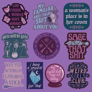 May include: A collection of nine vinyl stickers featuring witchy themes, purple and dark blue color palettes, and various phrases including God Forbid A Woman Have Hobbies, My Familiar And I Talk Shit About You, and Weird Girls Club on a purple background.