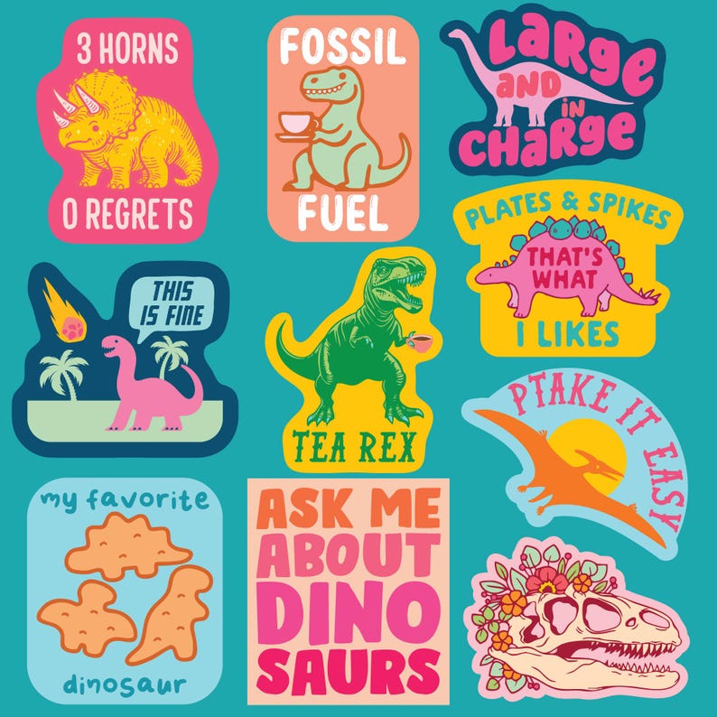 May include: A collection of colorful dinosaur-themed stickers with various designs and text. The stickers feature illustrations of dinosaurs, phrases like "3 HORNS," "FOSSIL FUEL," and "TEA REX," and other fun sayings. The background is a teal color.