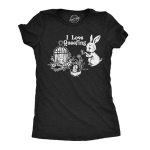 May include: Black t-shirt with a white graphic featuring a rabbit, a birdcage, and the text "I Love Queefing." The phrase "Bitch, Me Too!" is also printed on the shirt. The shirt has short sleeves and a crew neck.