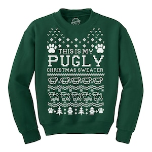May include: A dark green crewneck sweatshirt featuring a white knitted-style graphic pattern. The design includes the text THIS IS MY PUGLY CHRISTMAS SWEATER, surrounded by rows of pug silhouettes, paw prints, snowflakes, pine trees, and fire hydrants.