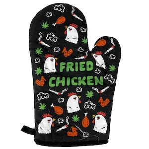 May include: Black oven mitt with a white background and a green and white design of fried chicken, marijuana leaves, and clouds. The text "Fried Chicken" is printed in green letters.