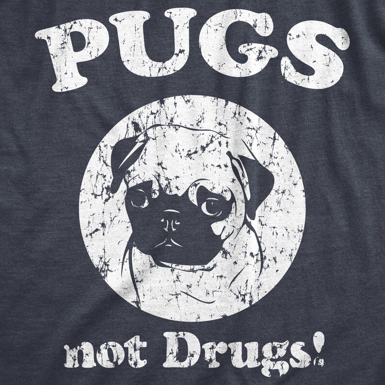 May include: A distressed white graphic on a navy blue t-shirt with a pug dog and the text "PUGS not Drugs!"