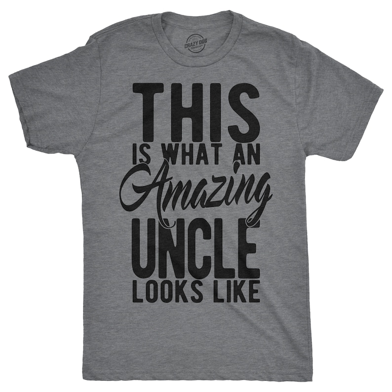 May include: A heather grey t-shirt with black text that reads "This is what an amazing uncle looks like".