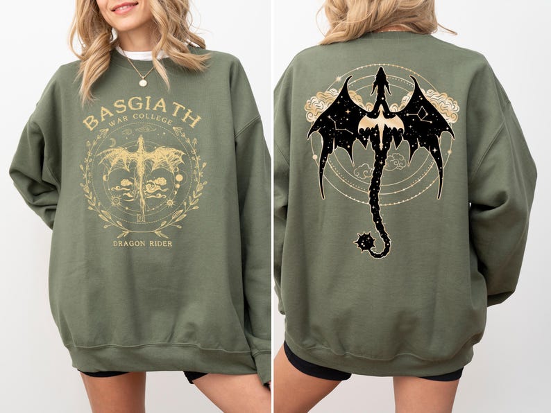 a woman wearing a green sweatshirt with a picture of a dragon on it