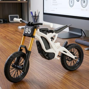 May include: A white and black miniature motorcycle with gold-colored front forks. The model has black tires and a black seat. The number "95" is displayed on the front. The handlebars are white.