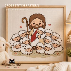 Puede incluir: Patrón de punto de cruz que presenta una representación de dibujos animados de Jesús con un bastón, rodeado de ovejas. La imagen está enmarcada en un marco de madera clara. El texto "CROSS STITCH PATTERN" y "INSTANT DOWNLOAD" están en la parte superior.
