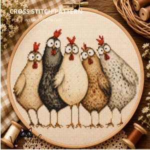 May include: A cross stitch pattern featuring five chickens with wide eyes and red combs, stitched on cream fabric within a wooden embroidery hoop. The text CROSS STITCH PATTERN PDF INSTANT DOWNLOAD is visible at the top of the circular design.