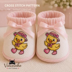 May include: A pair of baby booties with a cross-stitch design. The white booties have pink trim, bows, and a cartoon chick wearing a hat and boots. The text "CROSS STITCH PATTERN" and "PDF | INSTANT DOWNLOAD" is at the top.