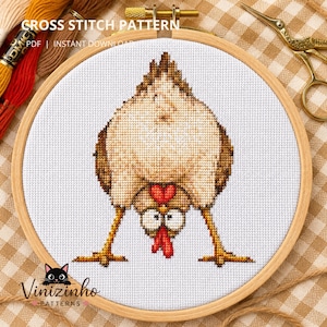May include: A cross stitch pattern in a wooden embroidery hoop featuring a white chicken with brown wings and a red comb, viewed from behind with its head upside down between its legs. The text reads CROSS STITCH PATTERN PDF INSTANT DOWNLOAD.