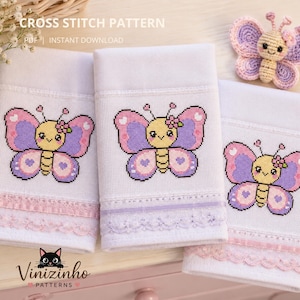 May include: White cross-stitch towels with a butterfly design in pink, purple, and yellow. The towels have a lace trim in pink and purple. A crocheted butterfly is also visible. The text "CROSS STITCH PATTERN" and "Vinizinho PATTERNS" are also visible.