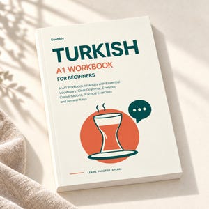 May include: A softcover Turkish A1 Workbook for Beginners by Seebbly with a cream cover, dark green and orange text, and a graphic of a tea glass on an orange circle. The text reads: Turkish A1 Workbook for Beginners, Learn. Practise. Speak.