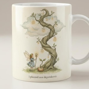 May include: A white ceramic mug featuring a printed illustration of a small winged figure standing beside a large, twisted tree with glowing hanging lanterns and a small sprout. The text "I planted one dependency." is printed at the bottom.
