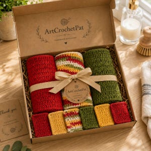 May include: A gift box containing handmade crochet items. The box includes red, yellow, green, and multi-colored crochet washcloths and towels. The box is tied with a tan ribbon and a tag that reads "ArtCrochetPat Handmade with Love."