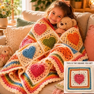 May include: A handmade crochet blanket featuring a pattern of colourful raised hearts in pink, green, blue, and orange on a cream background. A separate square crochet patch is shown in the corner with the text THIS IS THE SQUARE YOU GET.