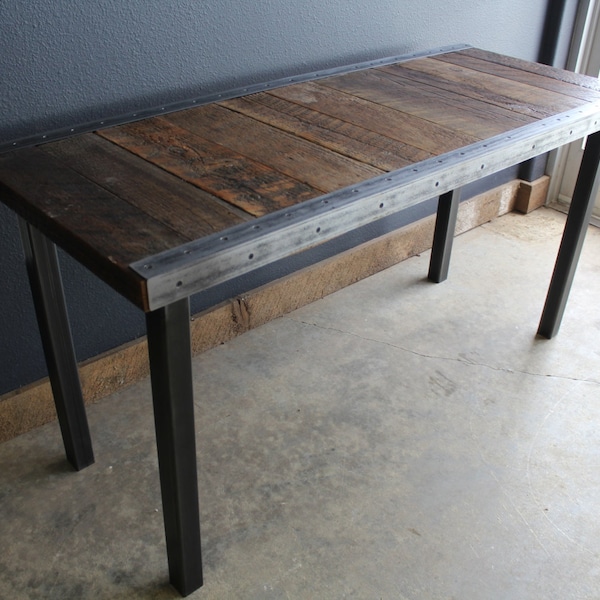 Industrial desk with raw steel trim and straight steel legs