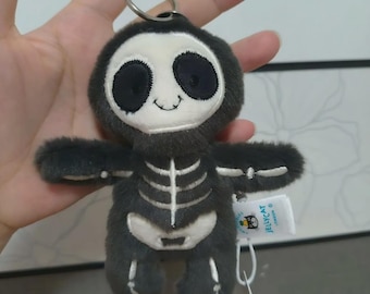 Portachiavi in peluche Jellycat Skeleton Bob, accessorio spettrale per Halloween a forma di animale di peluche.