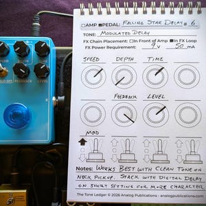 May include: A light blue guitar effects pedal with black knobs and a blue LED light. A notepad next to the pedal has handwritten notes about the pedal's settings, including "Falling Star Delay #6" and "Modulated Delay."