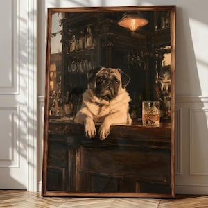 May include: A framed wall art print depicting a fawn-colored pug resting its front paws on a dark wooden bar counter. The scene is set in a dimly lit tavern with a glass of amber liquid and ice cubes beside the dog, under a warm hanging light.