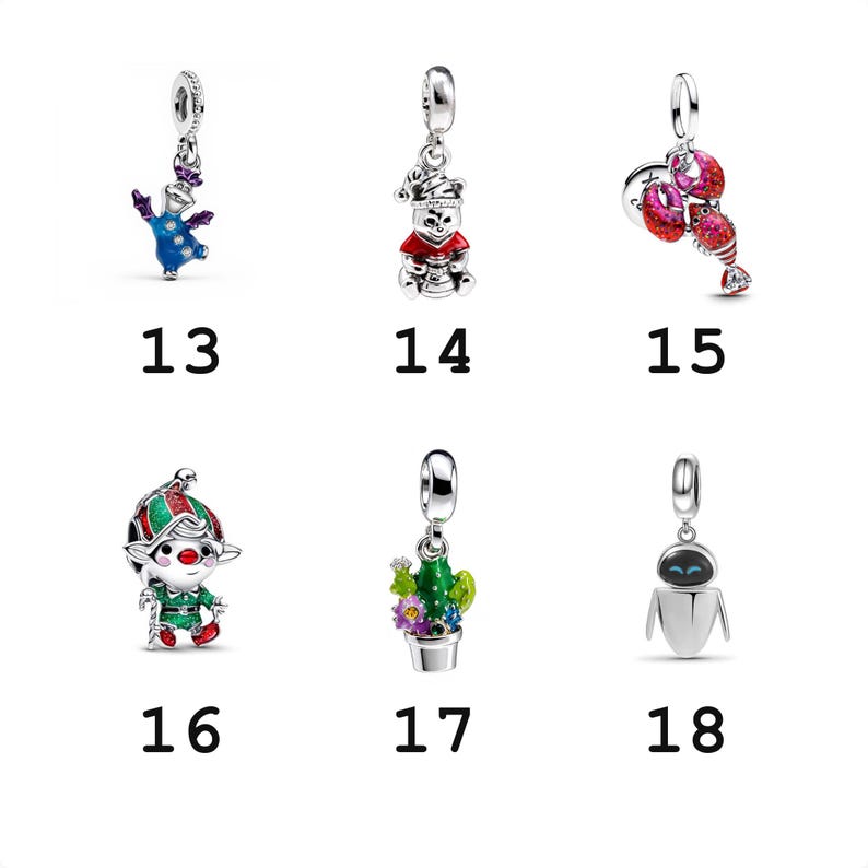 May include: A collection of six silver charms labeled 13 through 18. Charm 13 is a blue creature, 14 is a bear in a red hat, 15 is a red lobster, 16 is a green and red elf, 17 is a potted cactus with flowers, and 18 is a white robot figure.