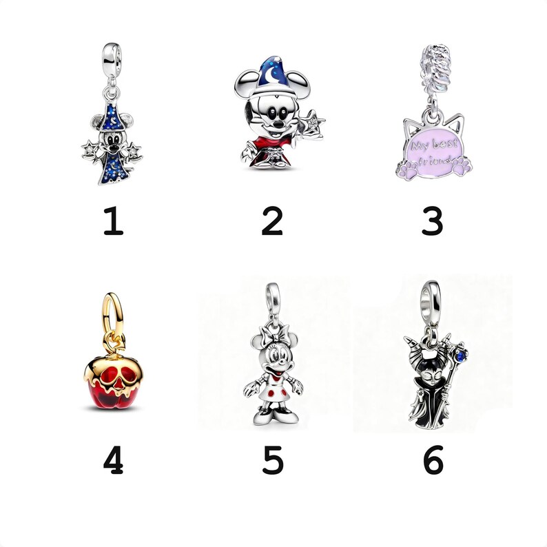 May include: Six silver-toned metal charms featuring Disney characters and icons: a wizard mouse in a blue hat, a wizard mouse head, a cat-shaped charm with the text My best friends, a red and gold apple, a mouse in a dress, and a dark-robed figure.