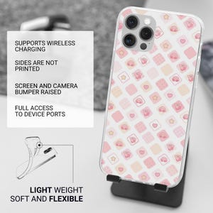 May include: A clear phone case with a repeating pattern of pink squares, stars, and hearts. The case features a cartoon character. Text on the case reads: "SUPPORTS WIRELESS CHARGING", "LIGHT WEIGHT SOFT AND FLEXIBLE".
