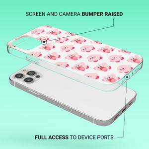 May include: Clear phone case with a repeating pattern of pink cartoon characters on a white background. The phone case is on top of a silver phone. The text on the image says "SCREEN AND CAMERA BUMPER RAISED" and "FULL ACCESS TO DEVICE PORTS".