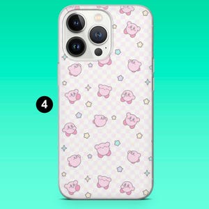 May include: A clear phone case featuring a repeating pattern of pink cartoon characters and stars on a light pink and white checkered background. The phone case has a camera cutout and a black number 4 in the corner.