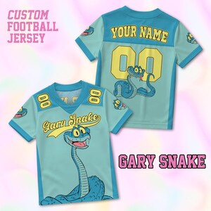 May include: Custom football jersey in light blue with a cartoon snake graphic. The jersey features the text "Gary Snake" and "Your Name" with the number "00" in yellow. The sleeves have a snake graphic.