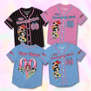 May include: Four baseball jerseys featuring The Powerpuff Girls cartoon characters. The jerseys are in black, pink, and blue with pink and blue accents. Each jersey has a different design, including the text "The Powerpuff Girls" and the option to add a name.