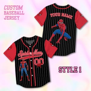 May include: A black baseball jersey with white pinstripes and red sleeves. The front features the text Spider-Man, a graphic of Spider-Man, and the number 00. The back displays the text YOUR NAME and a graphic of Spider-Man in a crouching pose.